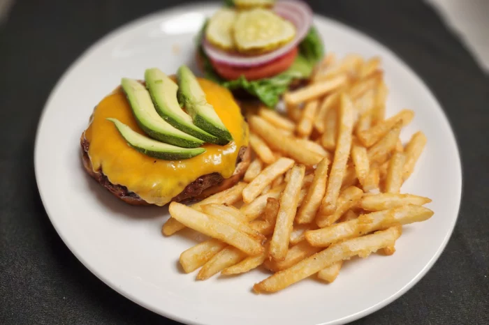 delicious food - cheeseburger and fries with avocado